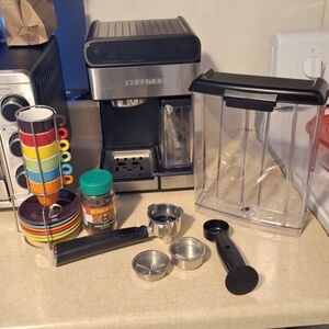 Chefman Silver and Black Coffee Maker with Multicolor Cup Set From Pier One.